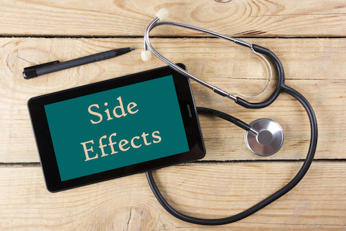 stethescope and slate board that says side effects